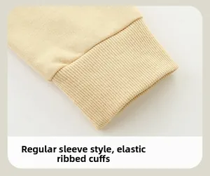 Detailed macro view of beige sweatshirt with soft elastic ribbed cuffs and regular sleeve