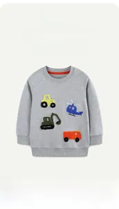 Detail of grey cotton sweatshirt featuring colorful embroidered construction vehicles