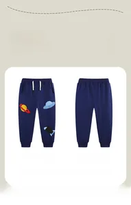 Detail view of navy blue kids' cotton joggers with space-themed embroidery and elastic waist