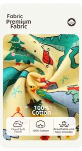 Close-up of 100% cotton fabric with cartoon dinosaur and Christmas tree print