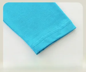 Detail of double-needle stitching on light blue knit sleeve cuff for boys' autumn T-shirt