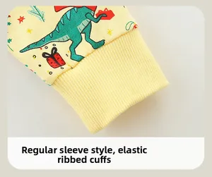 Detail of elastic ribbed cuffs on a yellow Christmas dinosaur pattern cotton sweatshirt