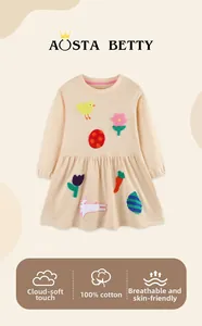 Detail of 100% cotton girls dress with cute colorful floral and animal embroidery