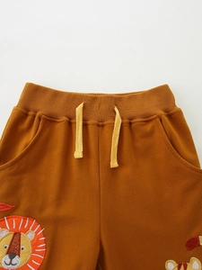 Caramel orange kids joggers with lion embroidery and elastic drawstring waist