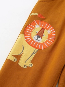 Kids sports pants in caramel cotton with a large cartoon lion embroidery detail