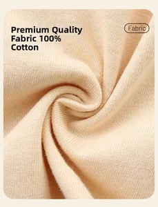 Macro shot of soft 100% cotton knit fabric for girl dresses in pink and apricot tones