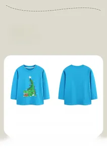 Detail view of boys bright blue long sleeve T-shirt with festive Christmas crocodile print