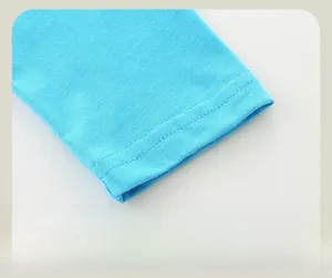 Detailed view of bright blue cotton knit cuffs with precise double-needle stitching