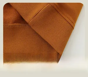Close-up of ribbed hem and precision stitching on this caramel kids sweatshirt