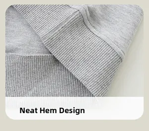 Macro detail of boys grey sweatshirt featuring ribbed hem and neat double stitching