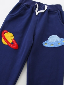 Navy blue kids joggers with galaxy chenille patches featuring Saturn and UFO embroidery