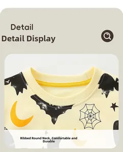 Close-up of ribbed crewneck detail and festive bat moon print on kids' Halloween sweatshirt