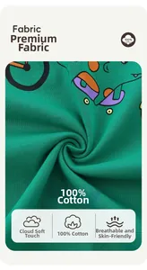 Detail of green 100% cotton knit fabric with cartoon dinosaur print for kids t-shirt