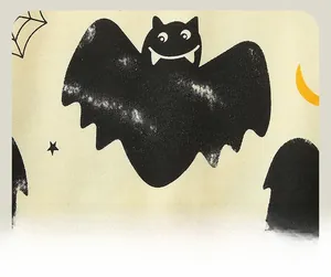 Close-up of Halloween bat and moon print on soft fabric for children sportswear