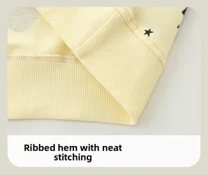 Macro detail of ribbed hem and neat stitching on yellow kids Halloween sweatshirt