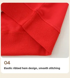 Macro shot of red knit sweatshirt hem with elastic ribbed cuffs and precise stitching