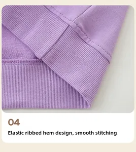 Close-up of the elastic ribbed hem on a purple cotton sweatshirt with neat stitching