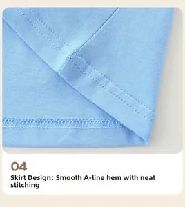 Détail de l'ourlet fluide en ligne A avec coutures soignées sur robe en coton fille