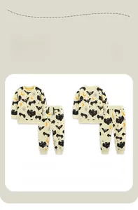 Detail view of children's pajama set featuring front and back Halloween bat print