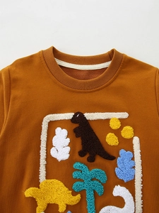 Kids orange dinosaur embroidered sweatshirt with textured patchwork palm tree and clouds