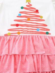 Girls' Christmas knit dress featuring abstract tree print and pink layered polka dot skirt