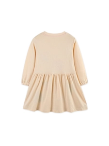 Girls long sleeve cotton dress in apricot beige with a pleated skirt back view