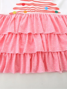 Girl's autumn dress featuring white print top and triple layered pink polka dot ruffles