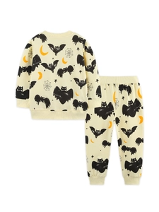 Kids Halloween pajamas set with bat and moon prints on beige long sleeve shirt and pants