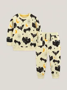 Kids Halloween loungewear set with bat and moon prints in cream yellow fabric