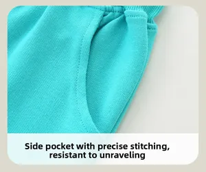 Detail of mint green girls joggers featuring side open pocket and reinforced stitching