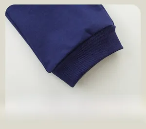 Detailed macro view of navy blue ribbed cuffs on boys knitted cotton sports pants