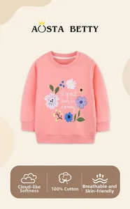 Close-up of pink cotton girls sweatshirt with floral print and a soft breathable texture