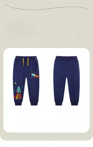 Detail of navy cotton joggers featuring rocket embroidery and yellow drawstrings