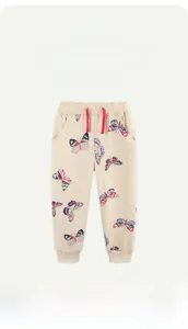 Detail of girls' cotton joggers featuring colorful butterfly prints and a pink drawstring