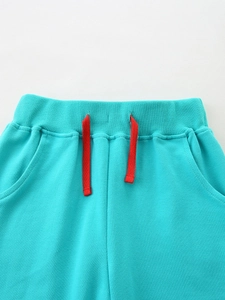 Girls sporty turquoise trousers with red drawstring waist and elastic waistband