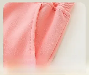 Detail of pink girls joggers featuring fine stitching on the side open pockets