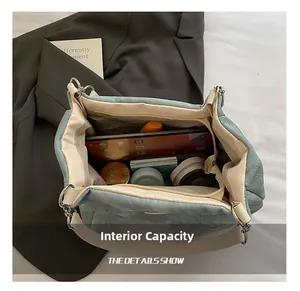 Top view of spacious interior of blue denim tote bag showing pockets and large capacity