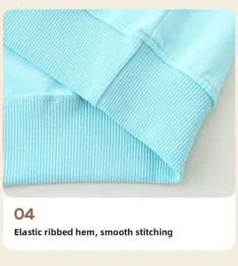 Detailed view of elastic ribbed hem and flat double-needle stitching on cotton sweatshirt