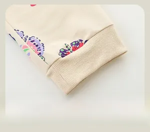 Detail of ribbed elastic cuffs on girls' cotton joggers with vibrant butterfly print