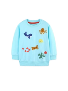 Girls light blue sweatshirt featuring ocean themed marine animal embroidery on white background