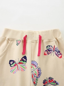 Girl's beige cotton joggers with colorful butterfly prints and elastic drawstring waist