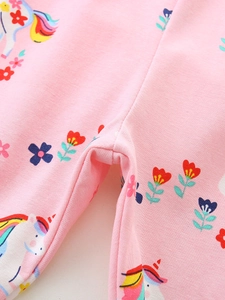 Pink girls leggings with unicorn and floral prints made of soft stretch knit fabric