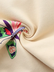 Girls beige cotton jogger pants featuring colorful butterfly print and soft knit texture