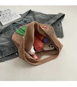Interior view of brown woven tote showing spacious capacity for phone and umbrella