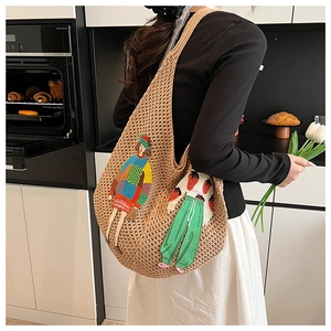 Detail of hand-woven crochet tote bag with vibrant cartoon character patchwork design