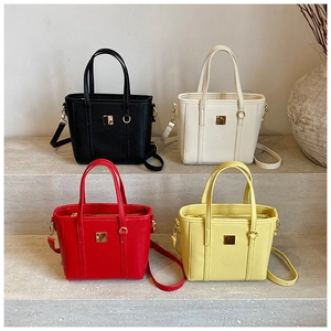 Litchi pattern leather bucket bags in black white red and yellow colors with gold buckle