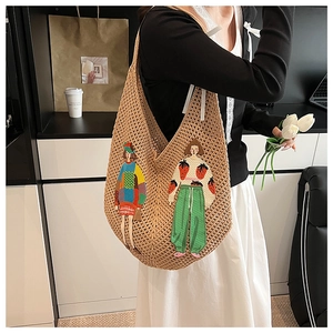 Detail of hand-woven tote bag featuring artistic female illustration patchwork and knit texture