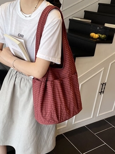 Minimalist red checkered canvas tote bag with multiple pockets for daily commuting