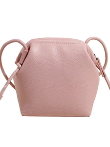 Pink lychee grain leather crossbody bag with geometric hexagonal shape on white background