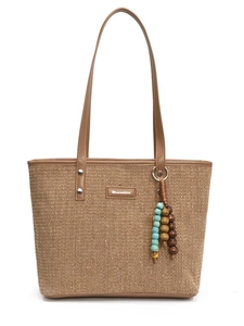 Large straw beach tote bag with brown leather handles and colorful beaded tassel detail